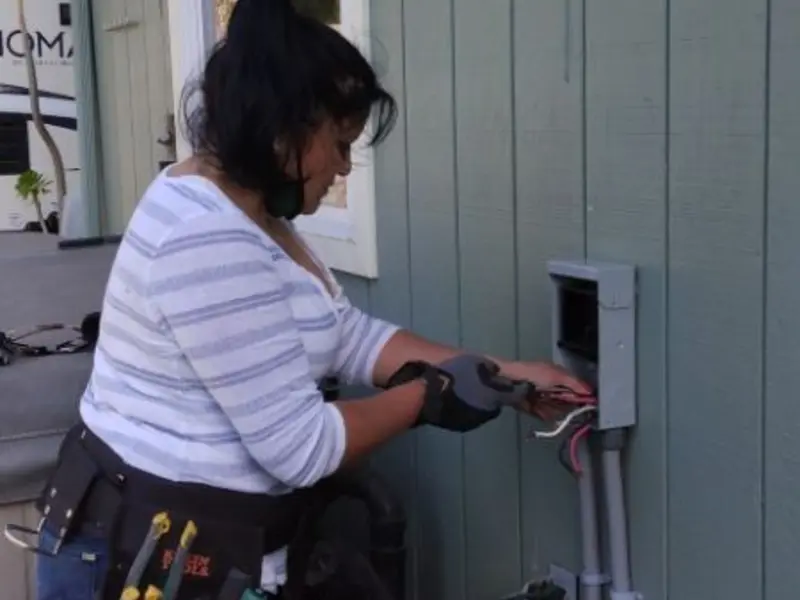 Licensed electrician wiring an exterior subpanel in Zion