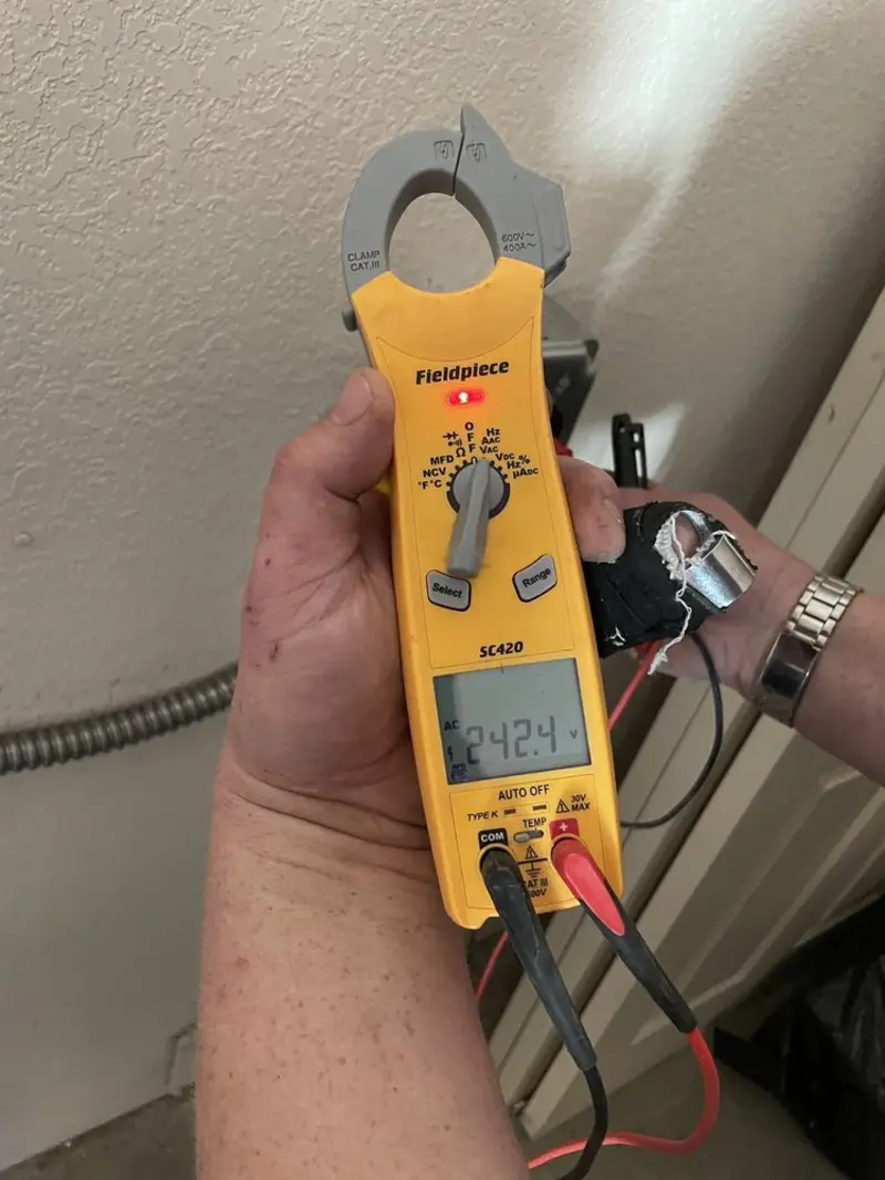 Voltage testing with clamp meter during Electrical Installation Services in Zion